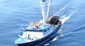 Marine fishing boat navigating through the ocean